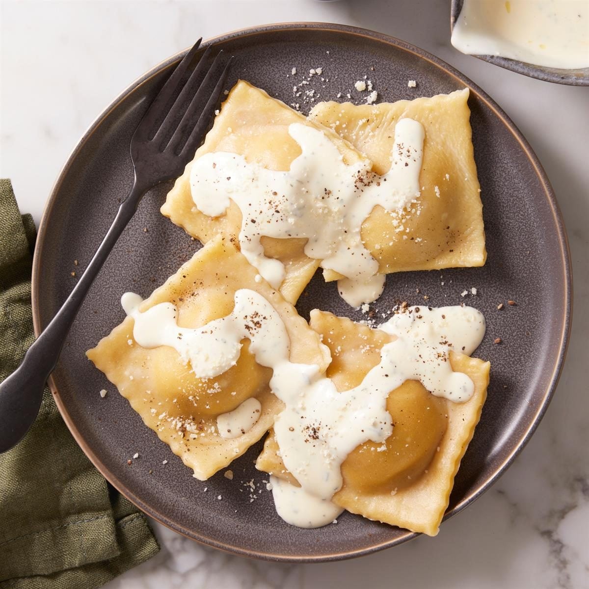 Impressive Pumpkin Ravioli: Cheesy Filling & Herby Butter Sauce